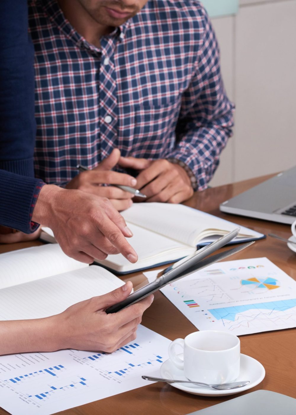 Business people discussing information on tablet screen